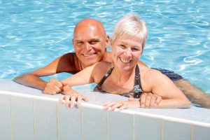 happy mature couple in the swimming pool