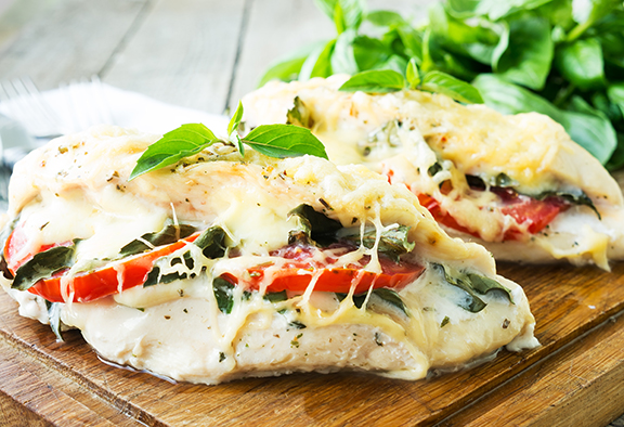Sauted Chicken Topped with tomatoes basil parmesan