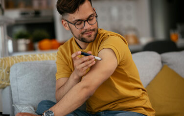 Man injecting insulin