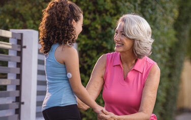 Woman and child with diabetes talking